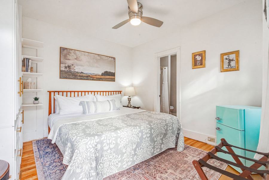 Bright guest room with a king bed and coastal-style furnishings