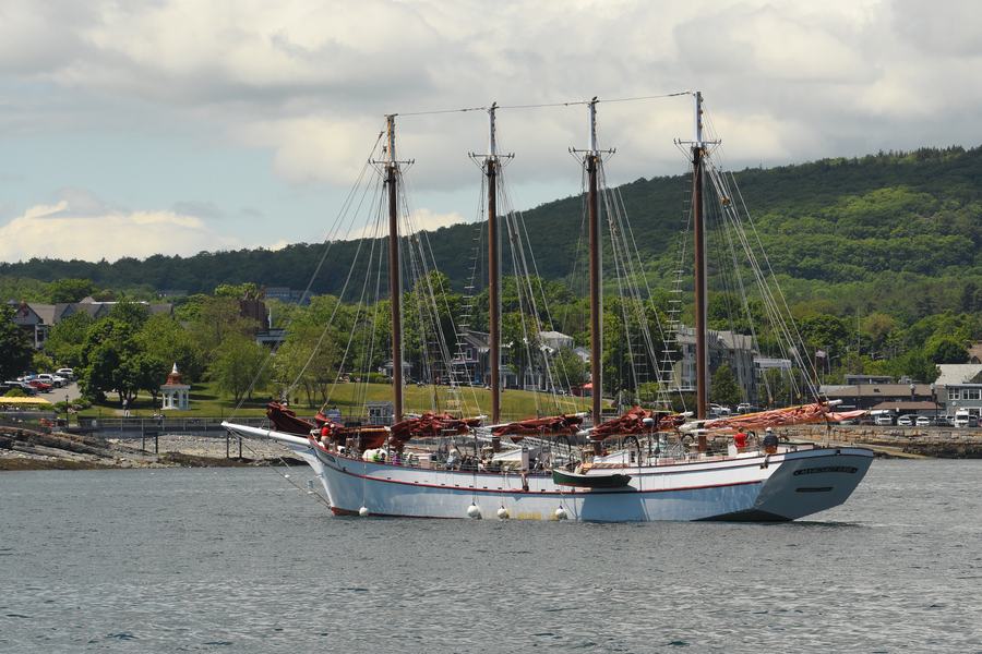 Schooner under sail in Boothbay Harbor at sunset during Windjammer Days